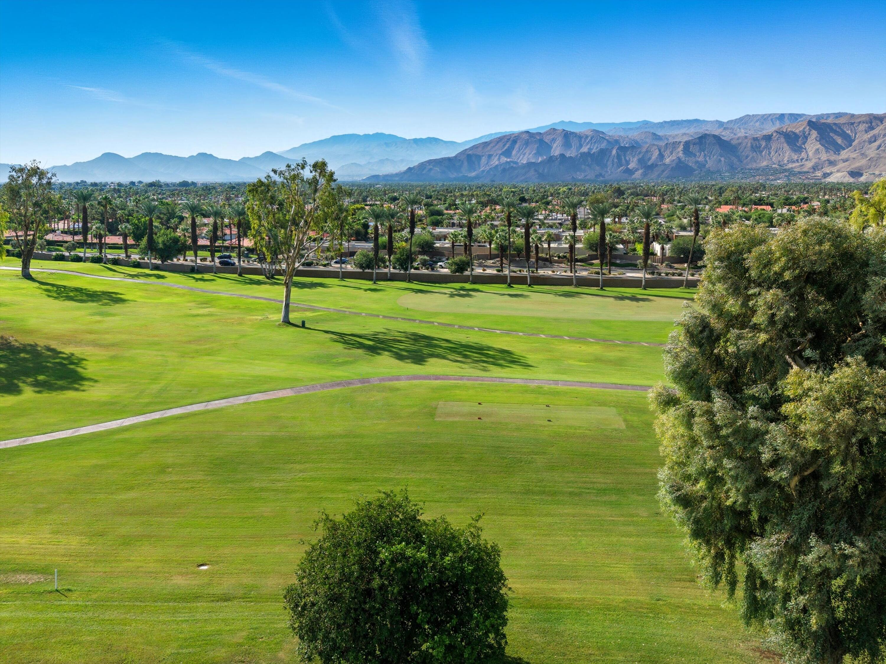 809 Inverness Drive Rancho Mirage, CA 92270 - Photo 3 of 36 a view of a city with mountains in the background