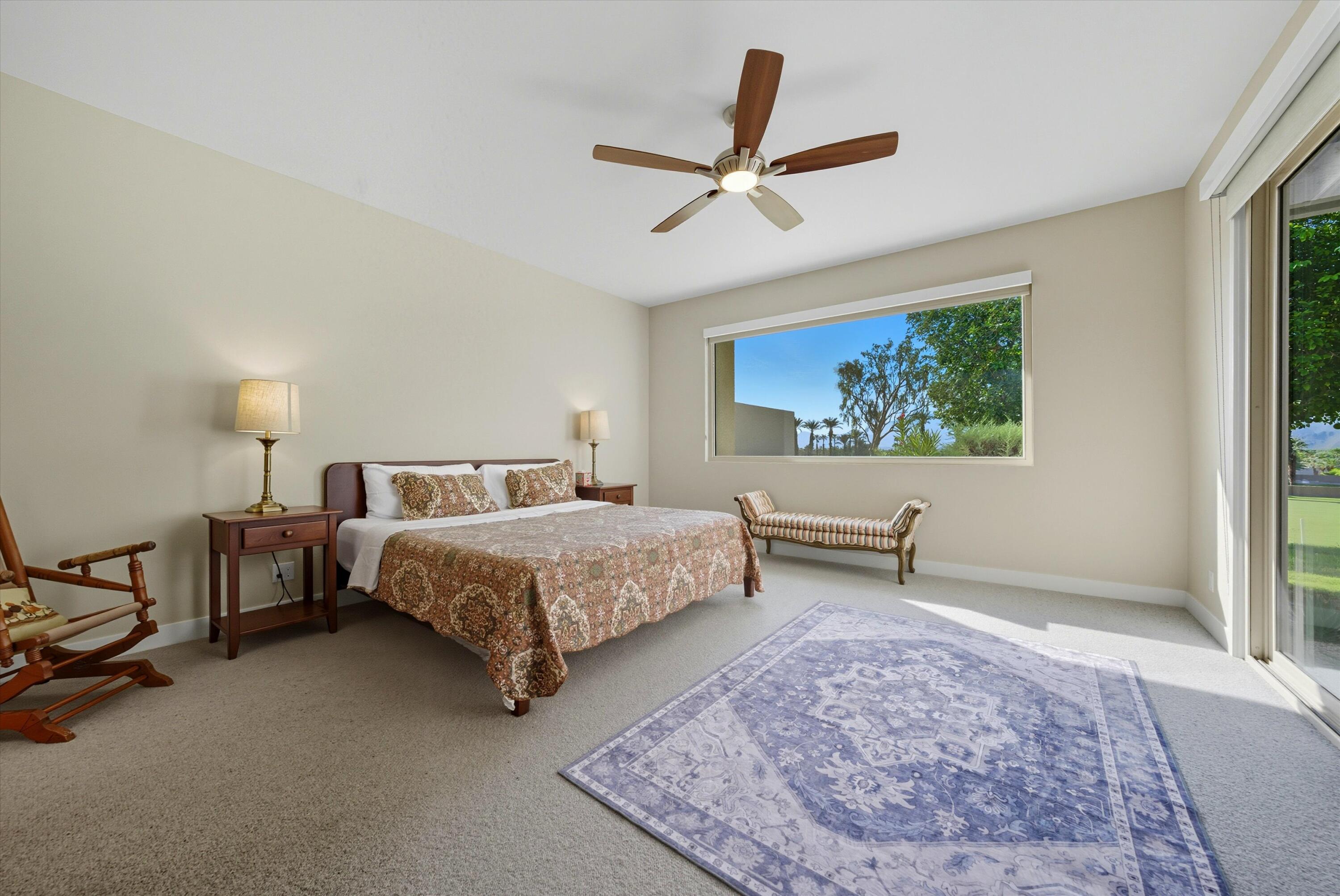 809 Inverness Drive Rancho Mirage, CA 92270 - Photo 31 of 36 a bedroom with a bed a dresser and a window