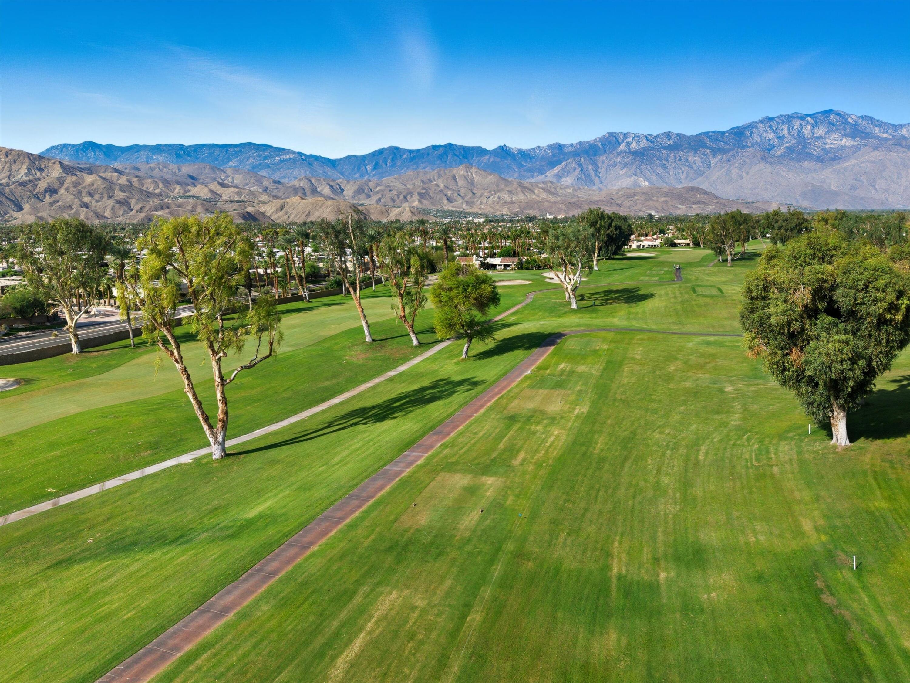809 Inverness Drive Rancho Mirage, CA 92270 - Photo 4 of 36 a view of an aerial view of a golf course with a lake view