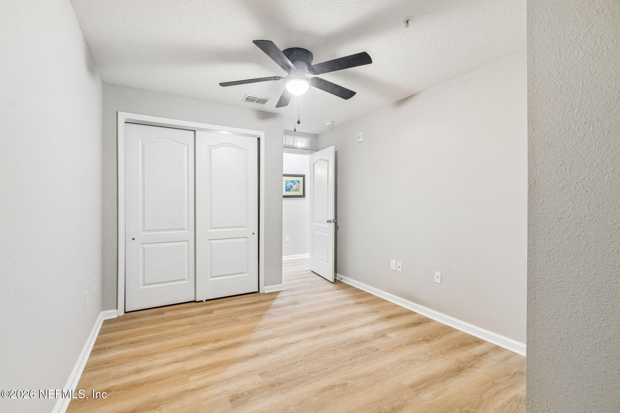 2113 Golden Lake Loop St. Augustine, FL 32084 - Photo 25 of 50 an empty room with closet and ceiling fan