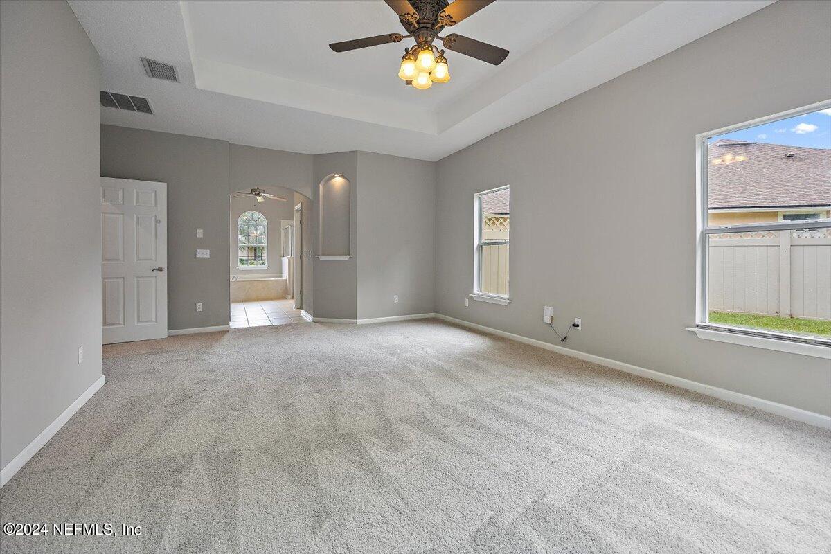2045 River's Own Road St. Augustine, FL 32092 - Photo 12 of 43 a view of a livingroom with a ceiling fan and window