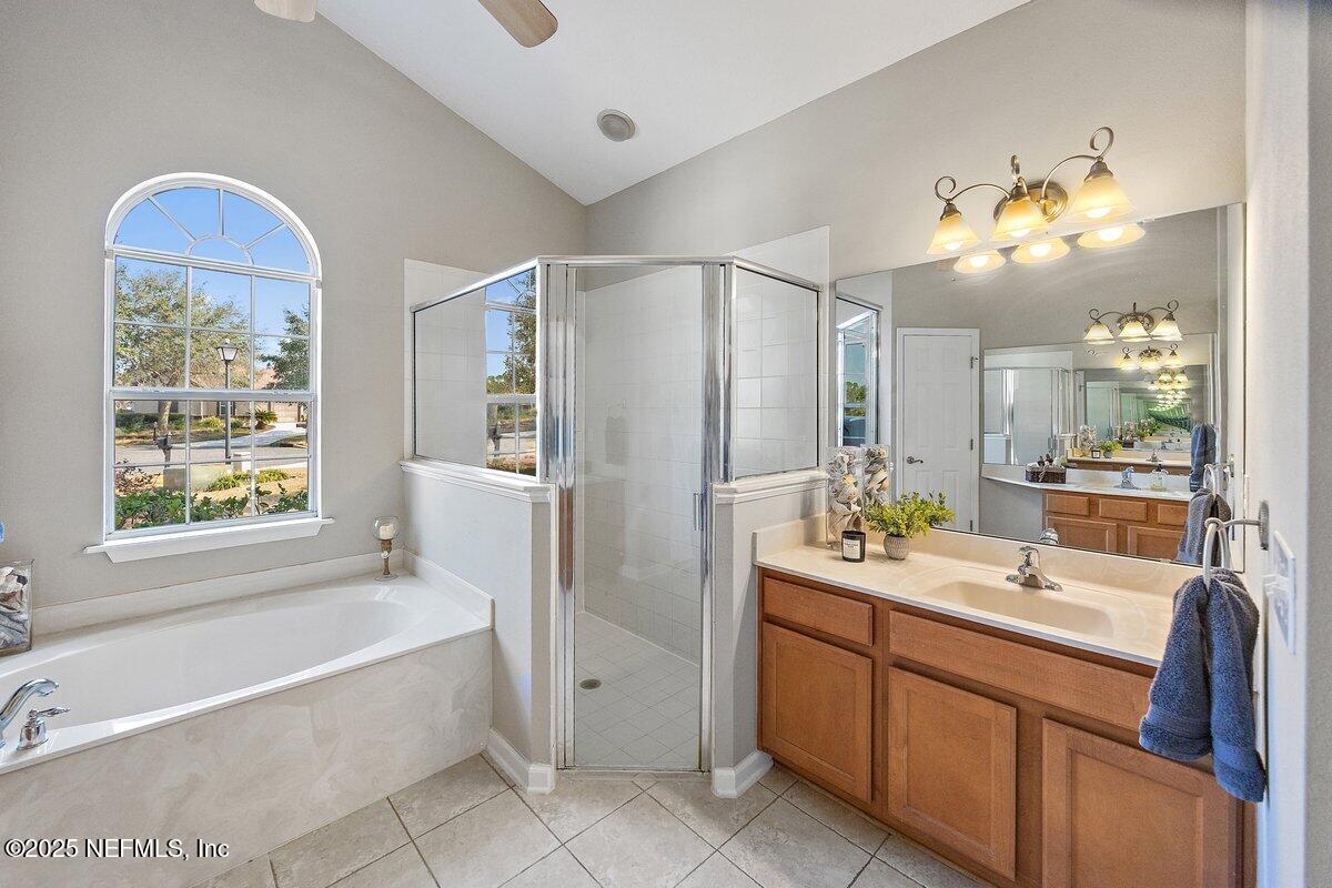 2045 River's Own Road St. Augustine, FL 32092 - Photo 13 of 43 a bathroom with a tub sink and mirror