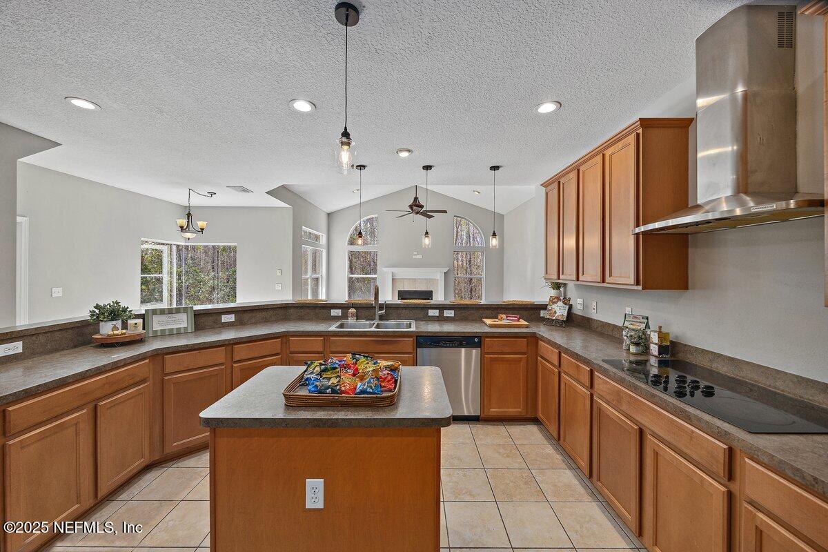 2045 River's Own Road St. Augustine, FL 32092 - Photo 17 of 43 a kitchen with stainless steel appliances a sink stove and cabinets