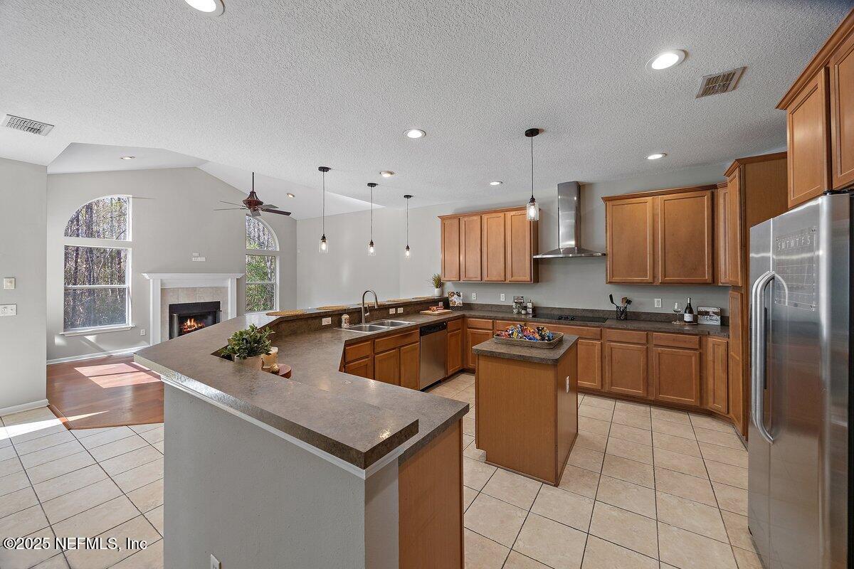 2045 River's Own Road St. Augustine, FL 32092 - Photo 18 of 43 a kitchen with a sink a counter top space stainless steel appliances and cabinets