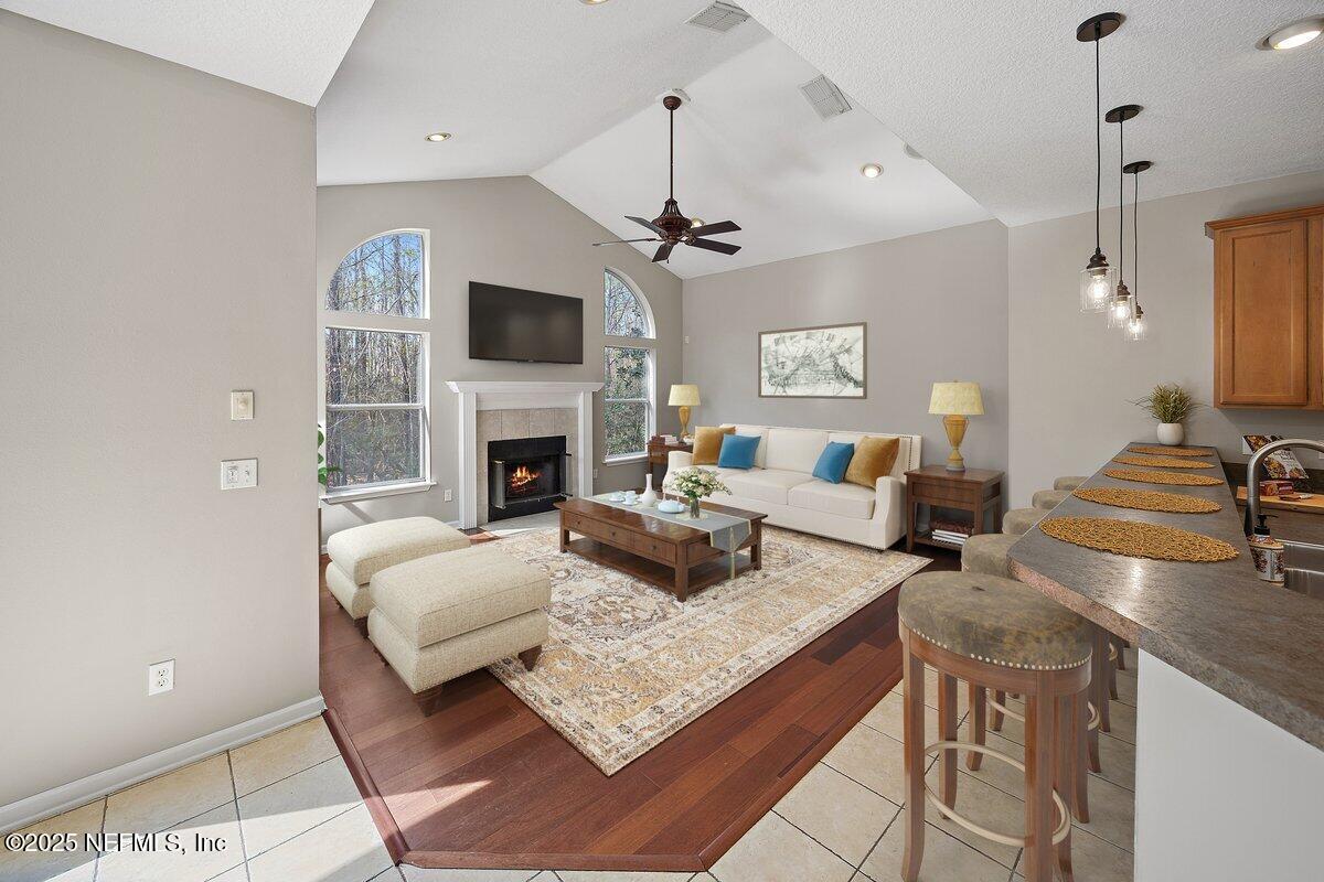 2045 River's Own Road St. Augustine, FL 32092 - Photo 20 of 43 a living room with fireplace furniture and a flat screen tv