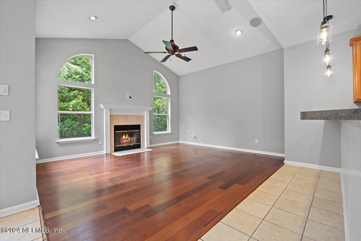 2045 River's Own Road St. Augustine, FL 32092 - Photo 21 of 43 a view of an empty room with a fireplace and a window