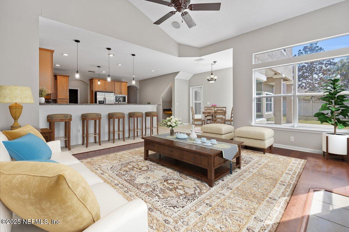 2045 River's Own Road St. Augustine, FL 32092 - Photo 22 of 43 a living room with furniture a rug and a large window