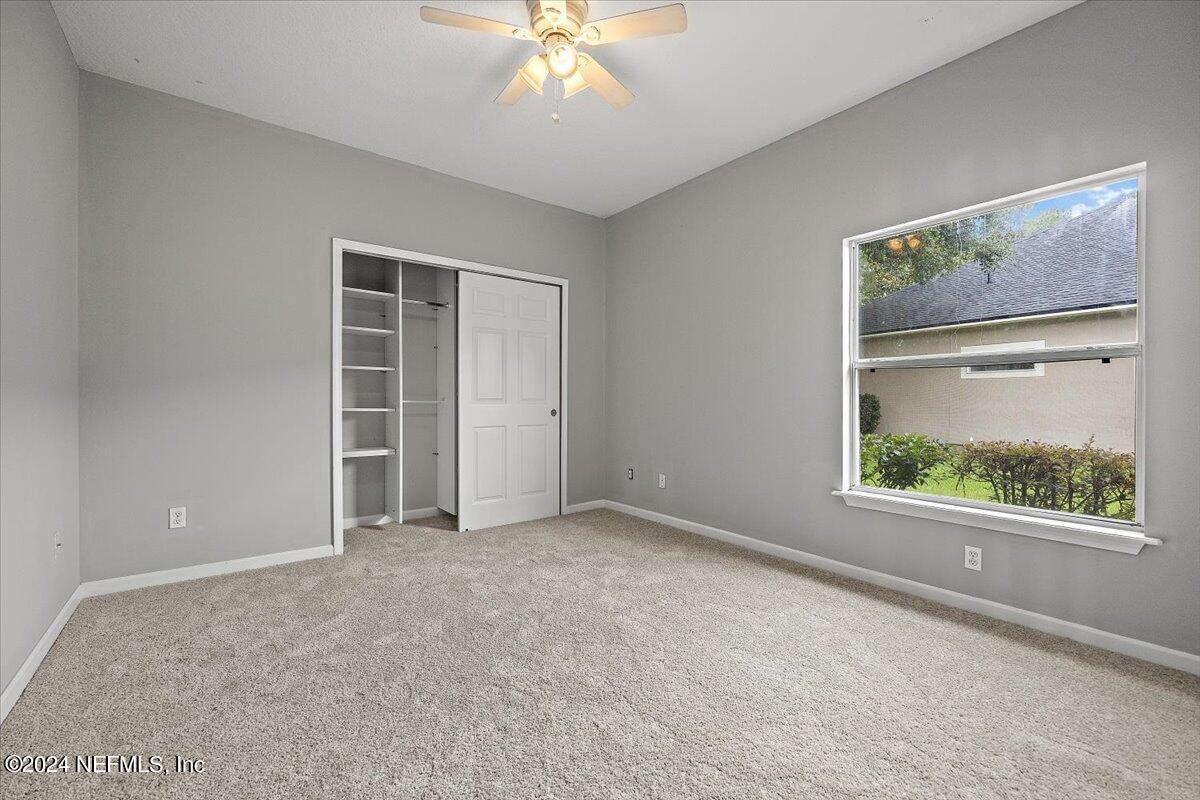 2045 River's Own Road St. Augustine, FL 32092 - Photo 25 of 43 an empty room with windows and closet