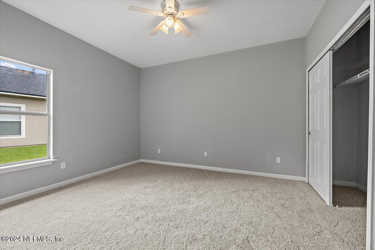 2045 River's Own Road St. Augustine, FL 32092 - Photo 27 of 43 a view of an empty room with a window