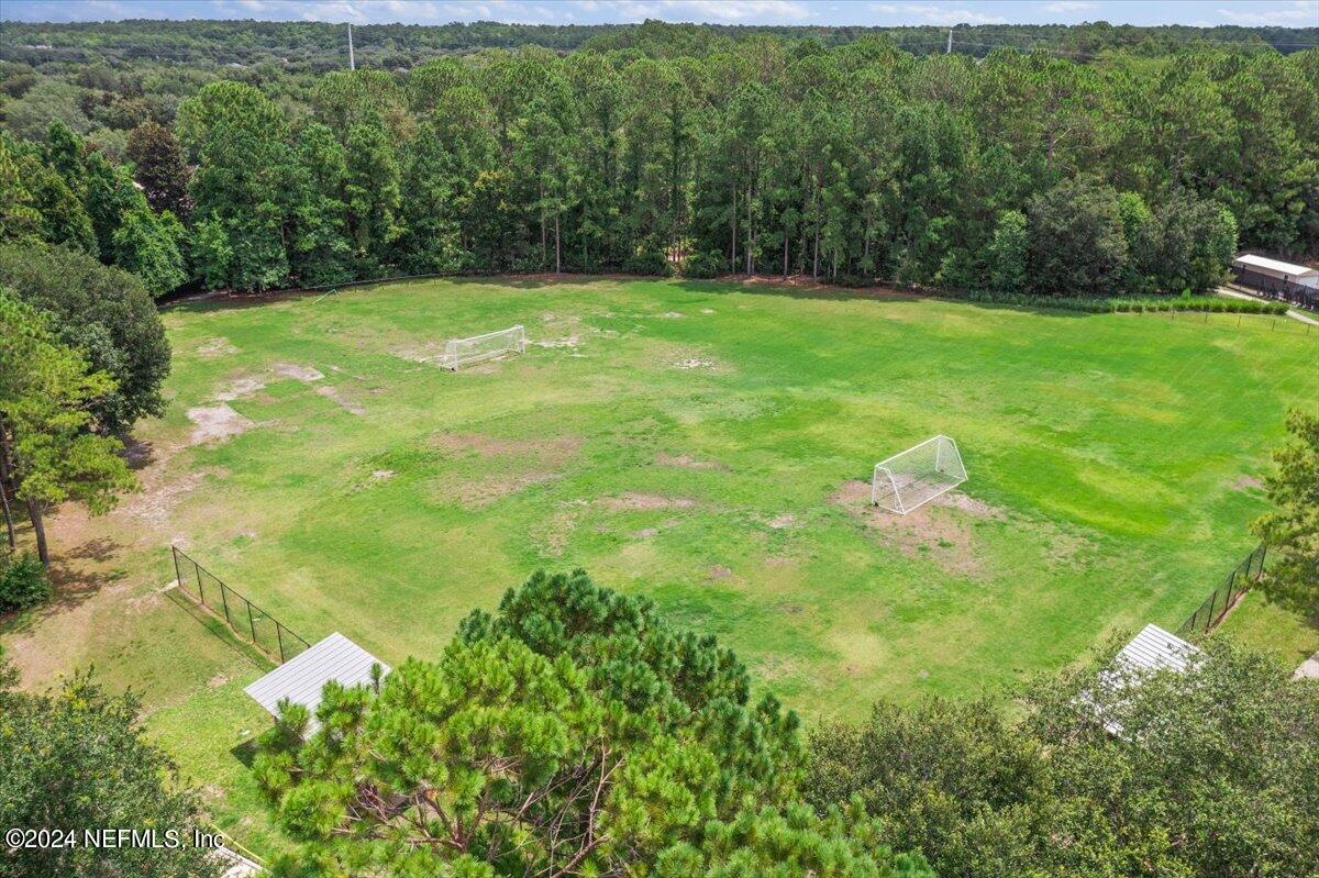 2045 River's Own Road St. Augustine, FL 32092 - Photo 36 of 43 a view of a green yard with large trees