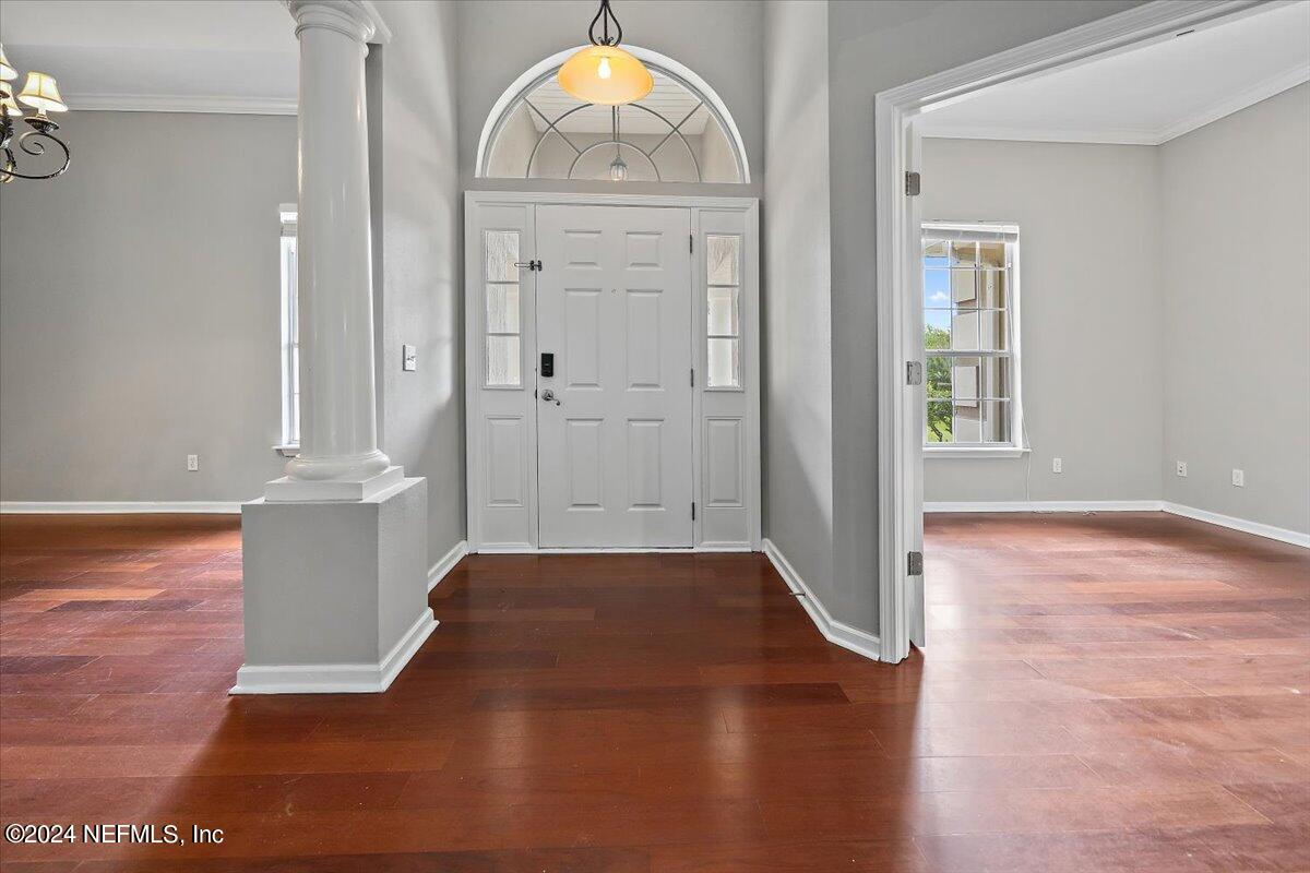 2045 River's Own Road St. Augustine, FL 32092 - Photo 4 of 43 an empty room with wooden floor and cabinet