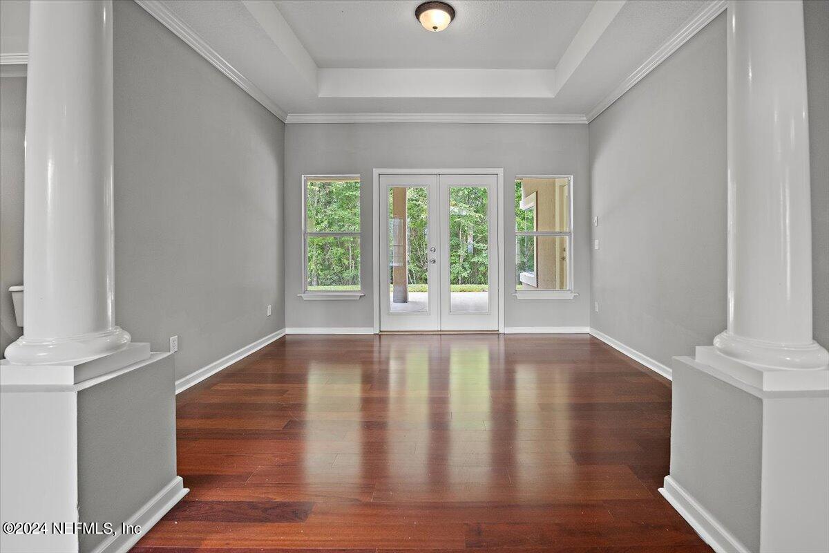 2045 River's Own Road St. Augustine, FL 32092 - Photo 6 of 43 a view of an empty room with wooden floor and a window