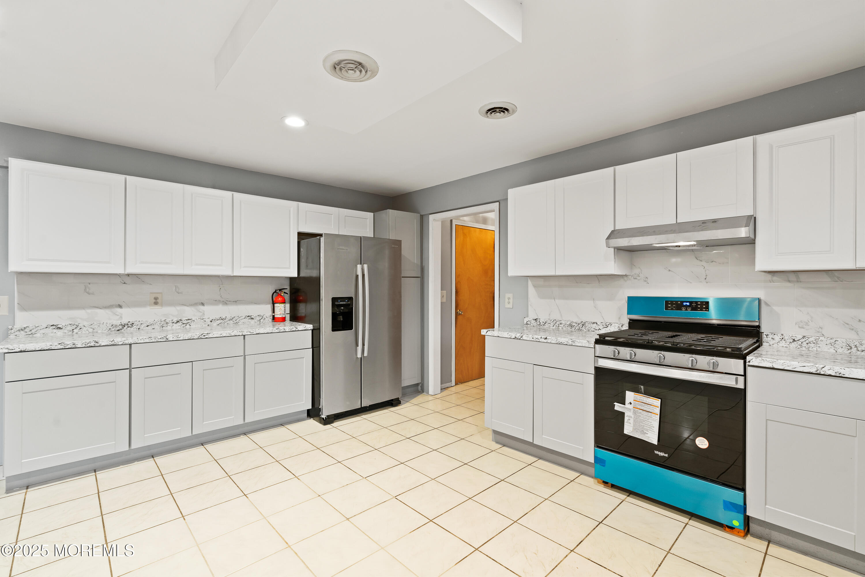 2003 Teakwood Road Toms River, NJ 08753 - Photo 17 of 47 a kitchen with a stove top oven sink and cabinets