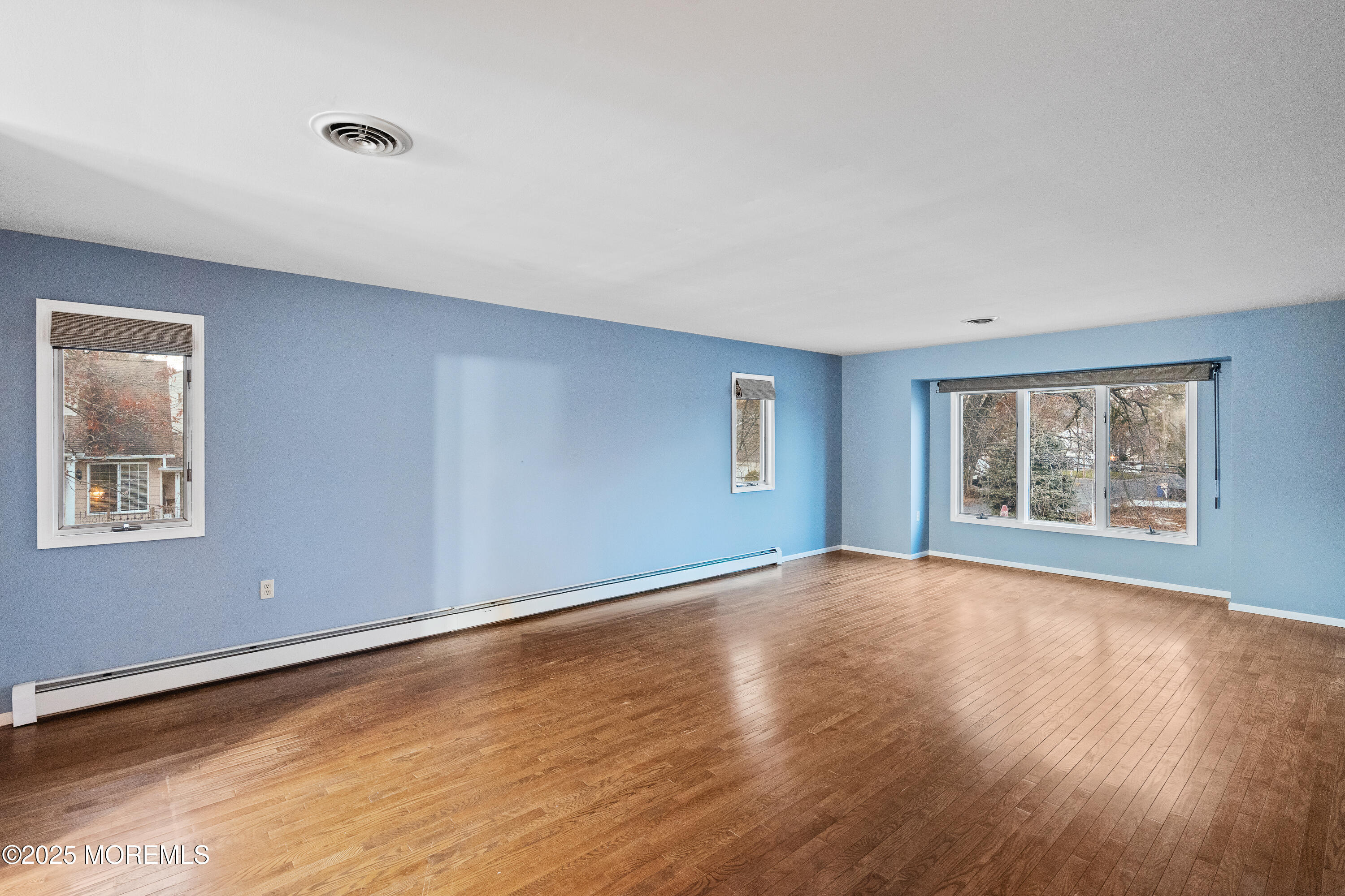 2003 Teakwood Road Toms River, NJ 08753 - Photo 32 of 47 a view of an empty room with wooden floor and a window