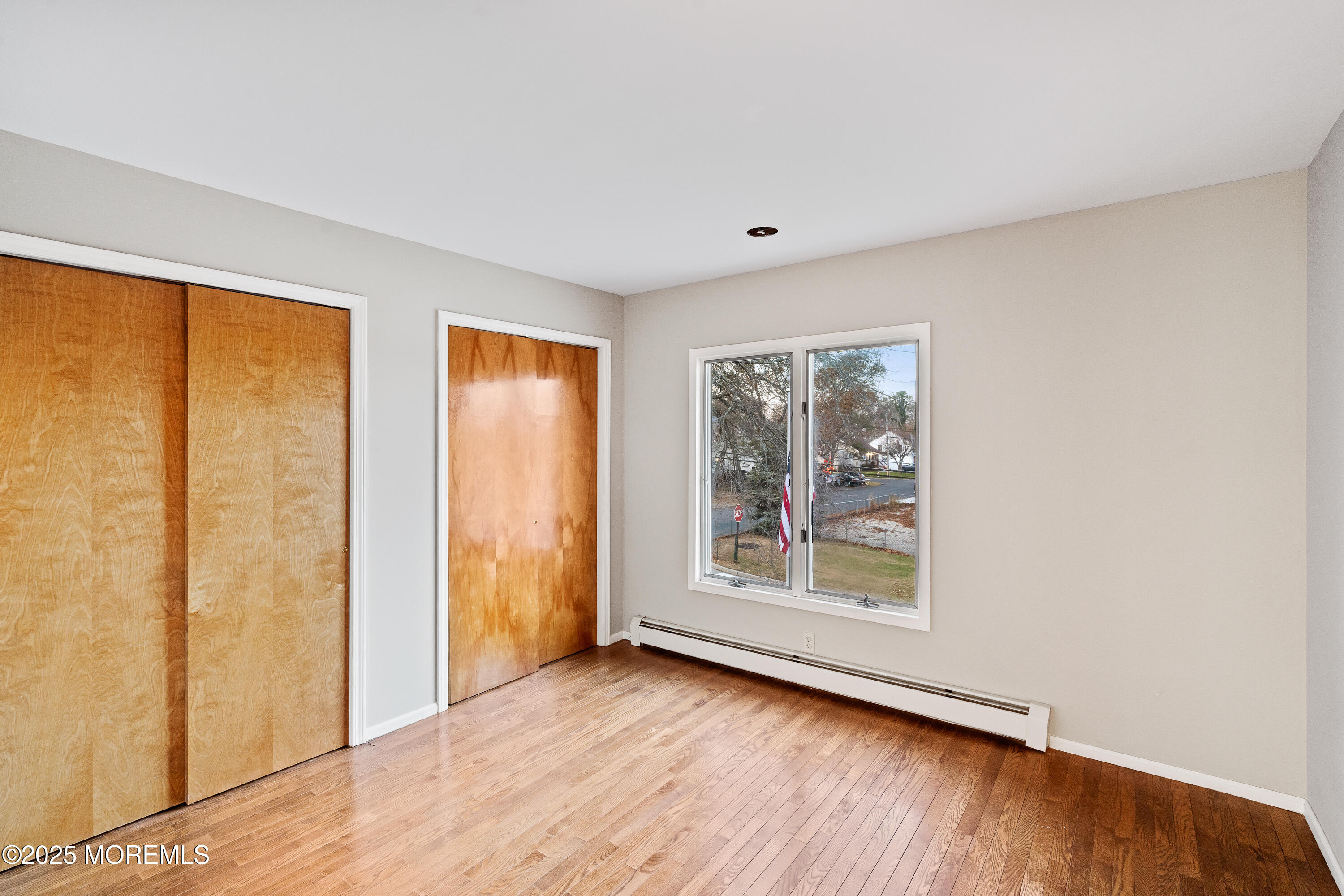 2003 Teakwood Road Toms River, NJ 08753 - Photo 35 of 47 a view of an empty room with wooden floor and a window