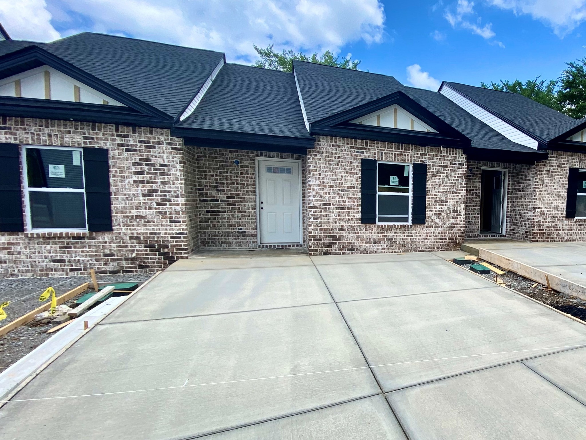 a front view of a house with yard