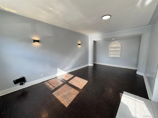 a view of wooden floor and windows in a room