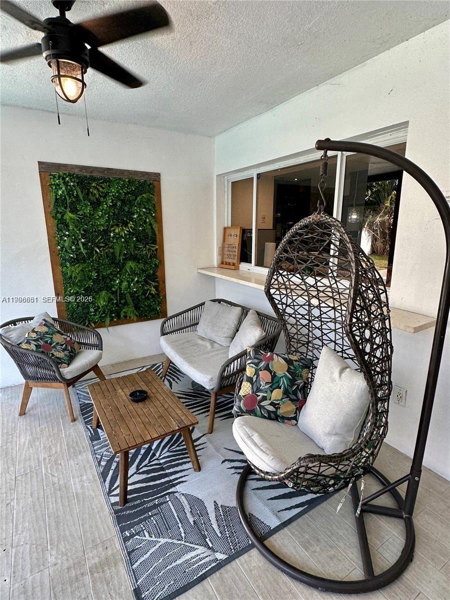 5424 Garfield Street Hollywood, FL 33021 - Photo 15 of 59 a living room with furniture and a fireplace