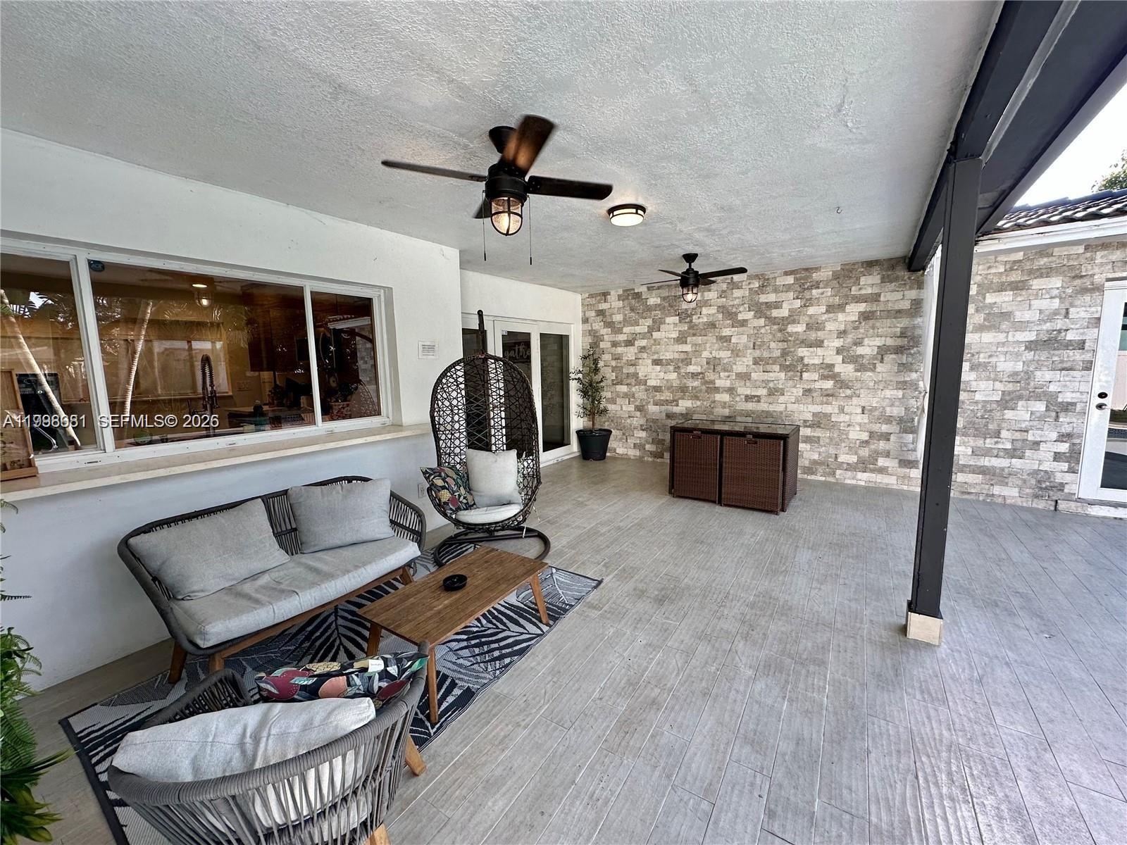5424 Garfield Street Hollywood, FL 33021 - Photo 18 of 59 a living room with furniture and a fireplace