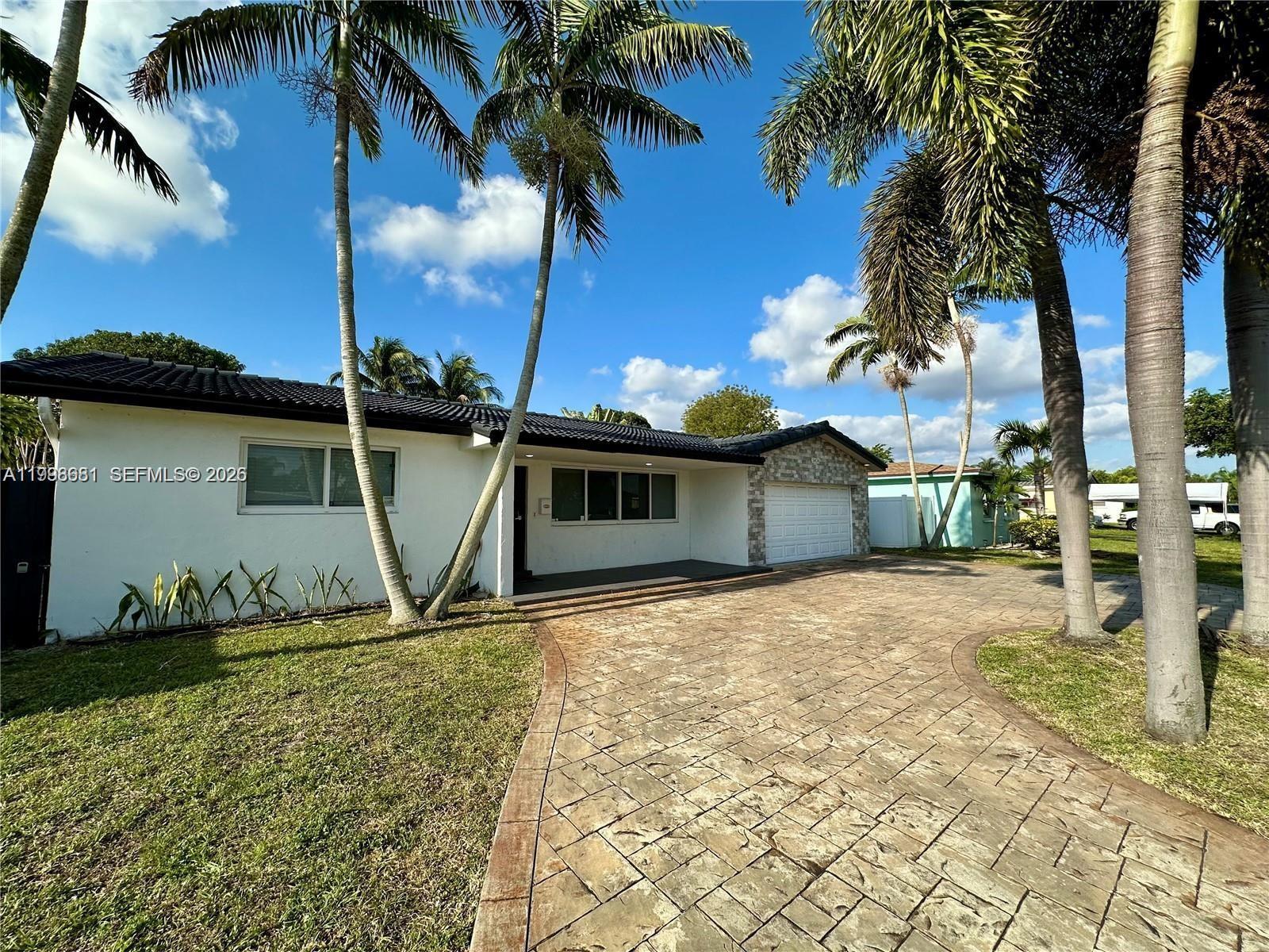 5424 Garfield Street Hollywood, FL 33021 - Photo 2 of 59 a view of a backyard of the house