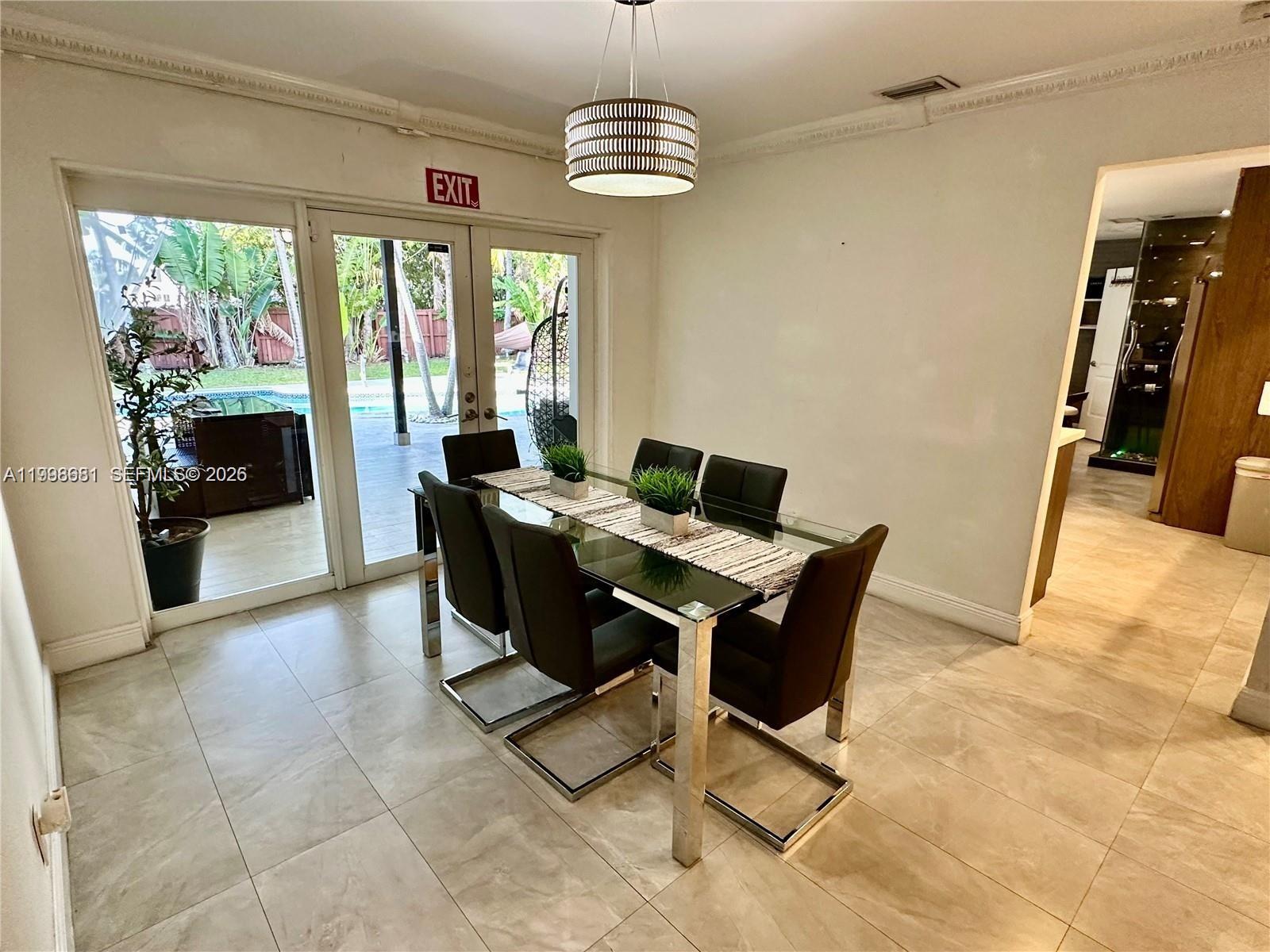 5424 Garfield Street Hollywood, FL 33021 - Photo 38 of 59 a view of a dining room with furniture window and outside view