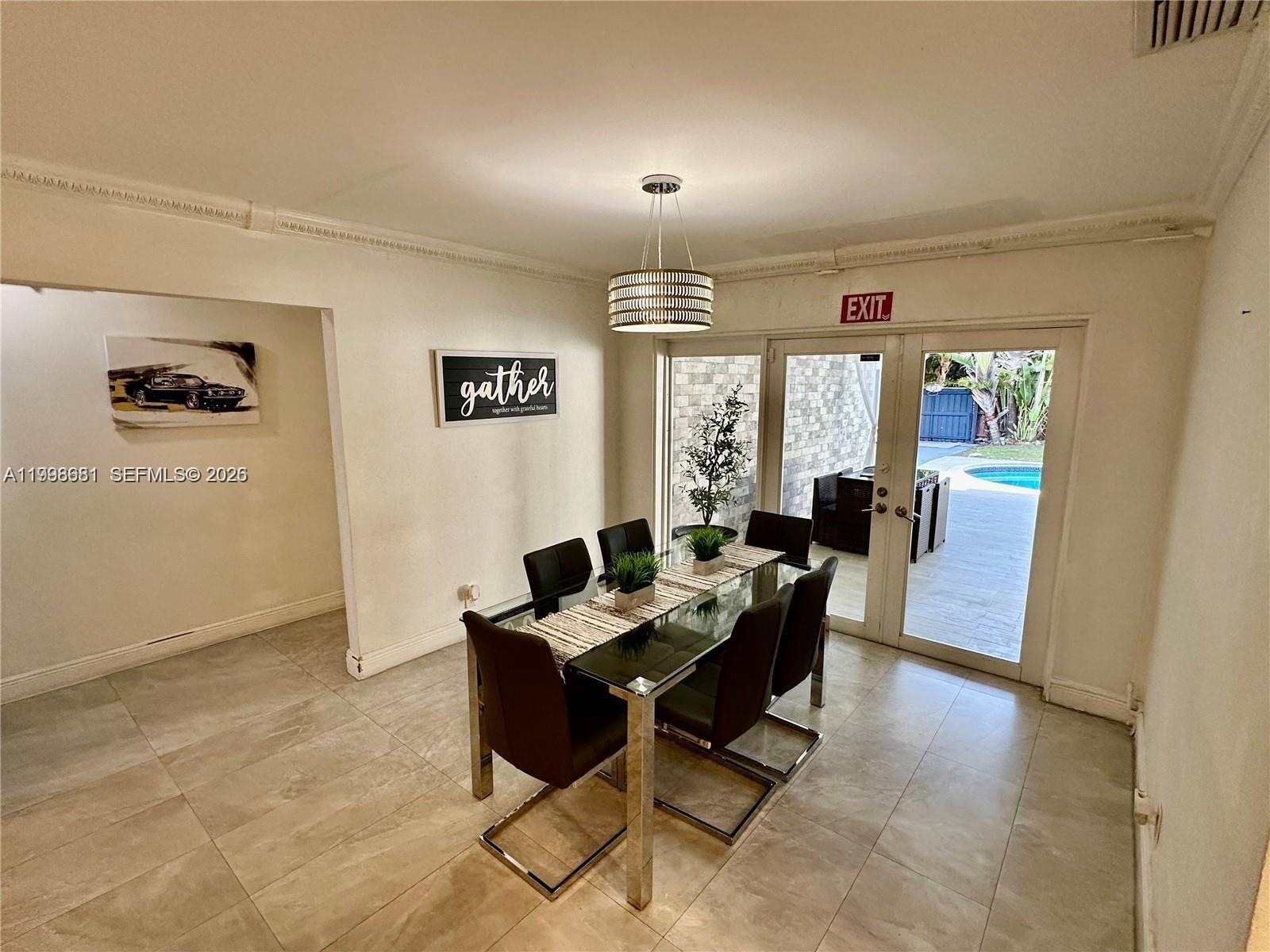 5424 Garfield Street Hollywood, FL 33021 - Photo 40 of 59 a dining room with furniture and window