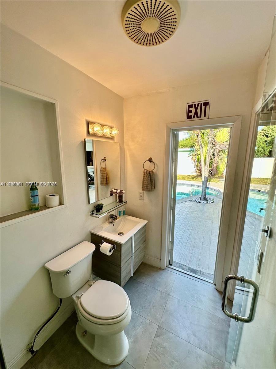 5424 Garfield Street Hollywood, FL 33021 - Photo 44 of 59 a bathroom with a sink toilet and shower