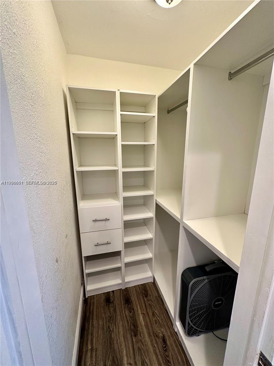5424 Garfield Street Hollywood, FL 33021 - Photo 54 of 59 a view of walk in closet with empty racks