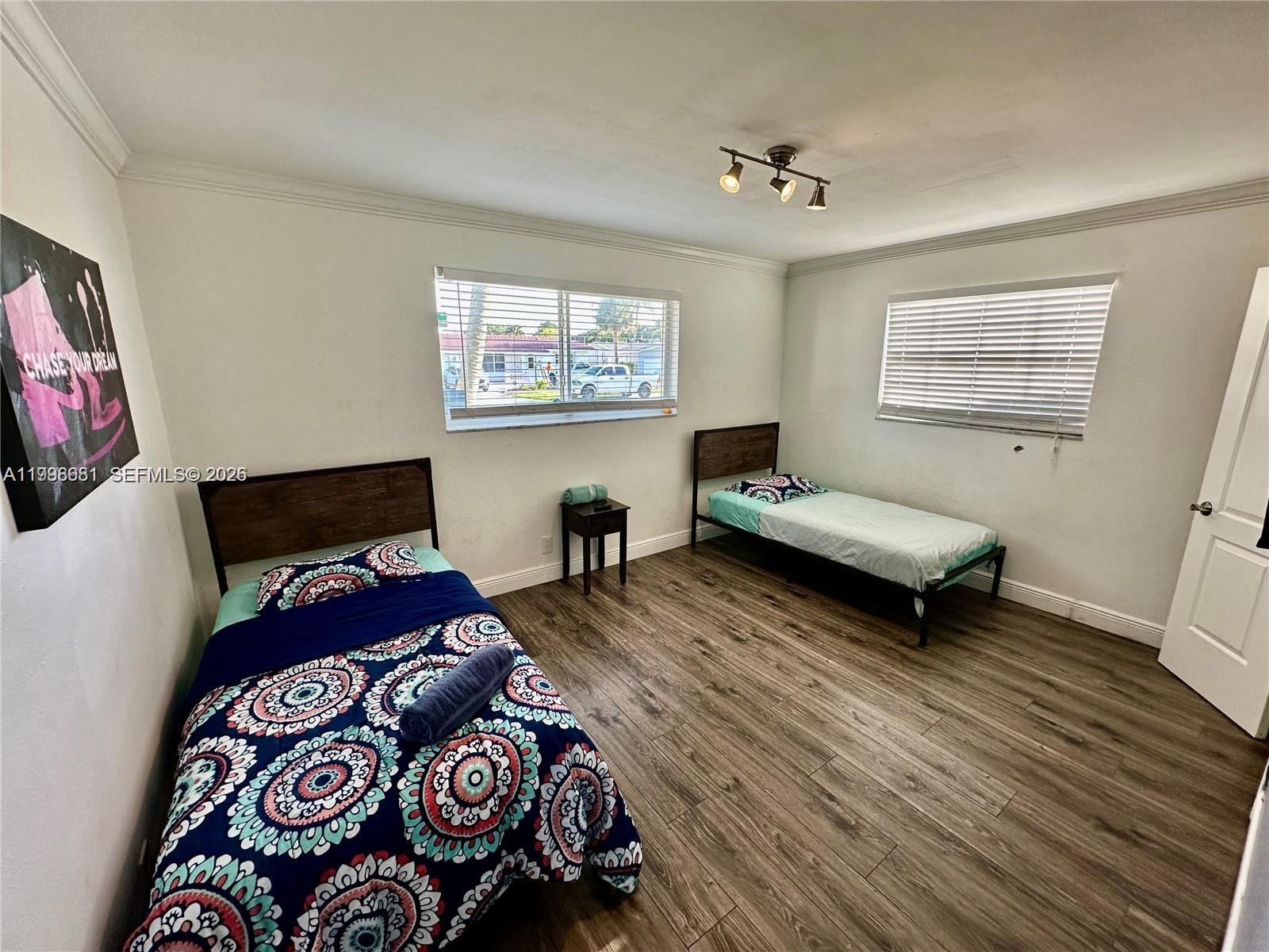 5424 Garfield Street Hollywood, FL 33021 - Photo 57 of 59 a living room with furniture and a flat screen tv
