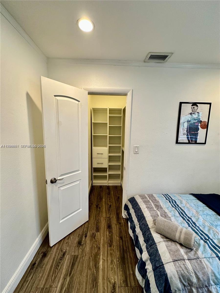 5424 Garfield Street Hollywood, FL 33021 - Photo 59 of 59 a bedroom with a bed and a window