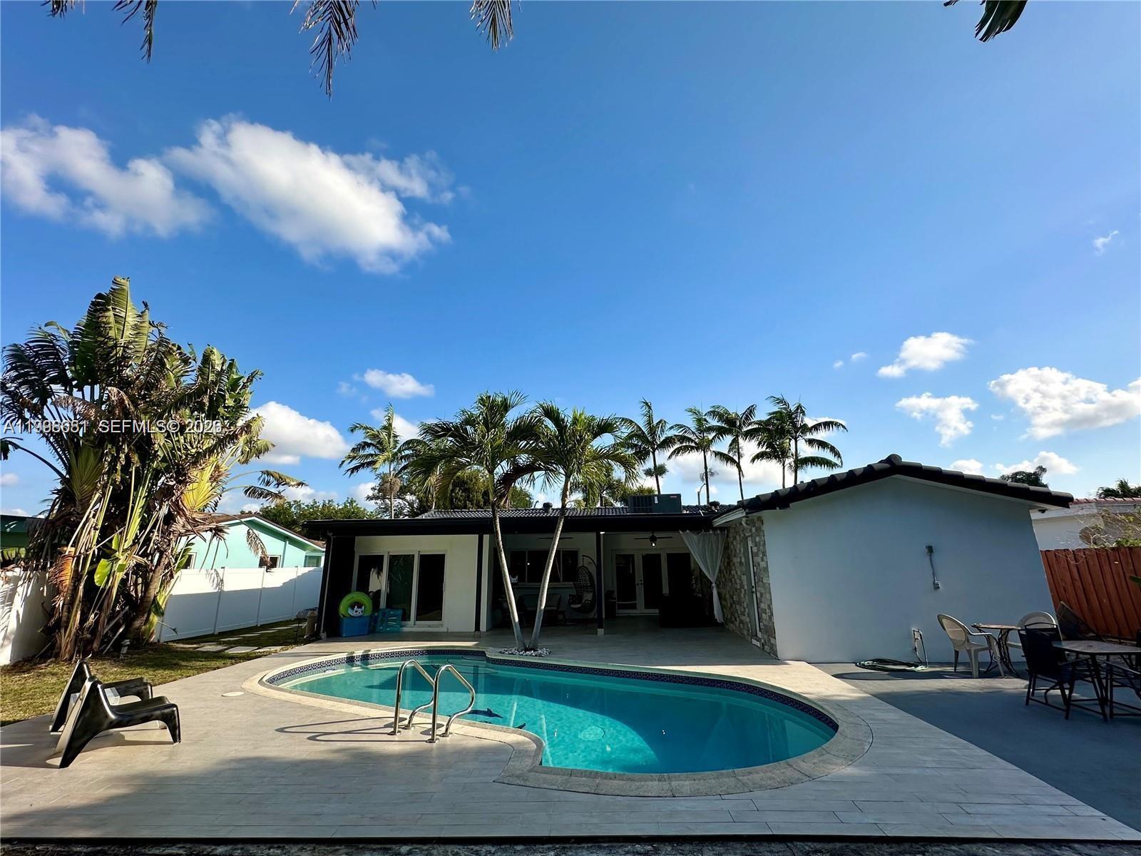 5424 Garfield Street Hollywood, FL 33021 - Photo 9 of 59 a front view of a house with a yard