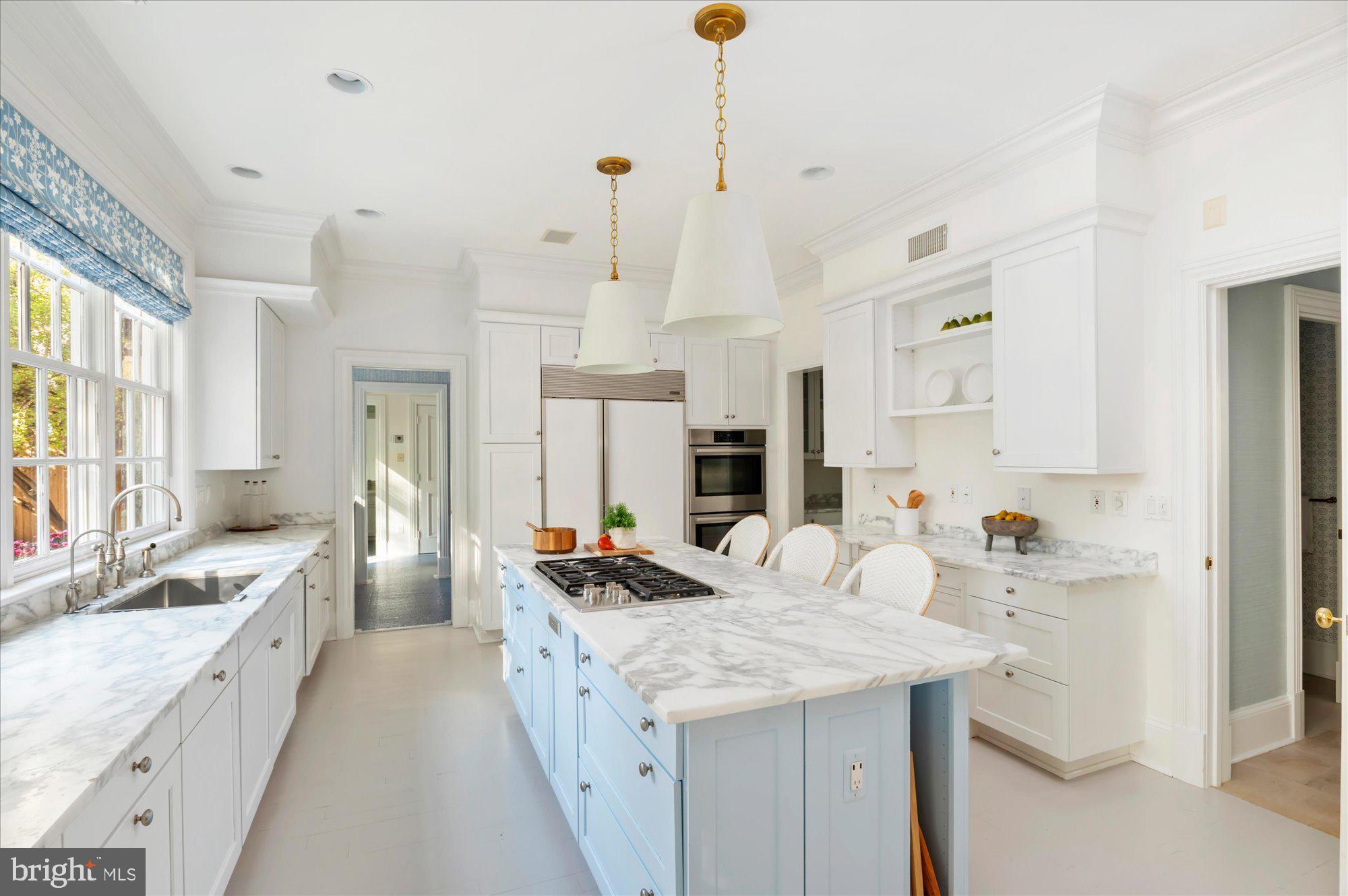2950 Chain Bridge Road Northwest Washington, DC 20016 - Photo 11 of 50 a large kitchen with kitchen island a large counter space a sink appliances and cabinets
