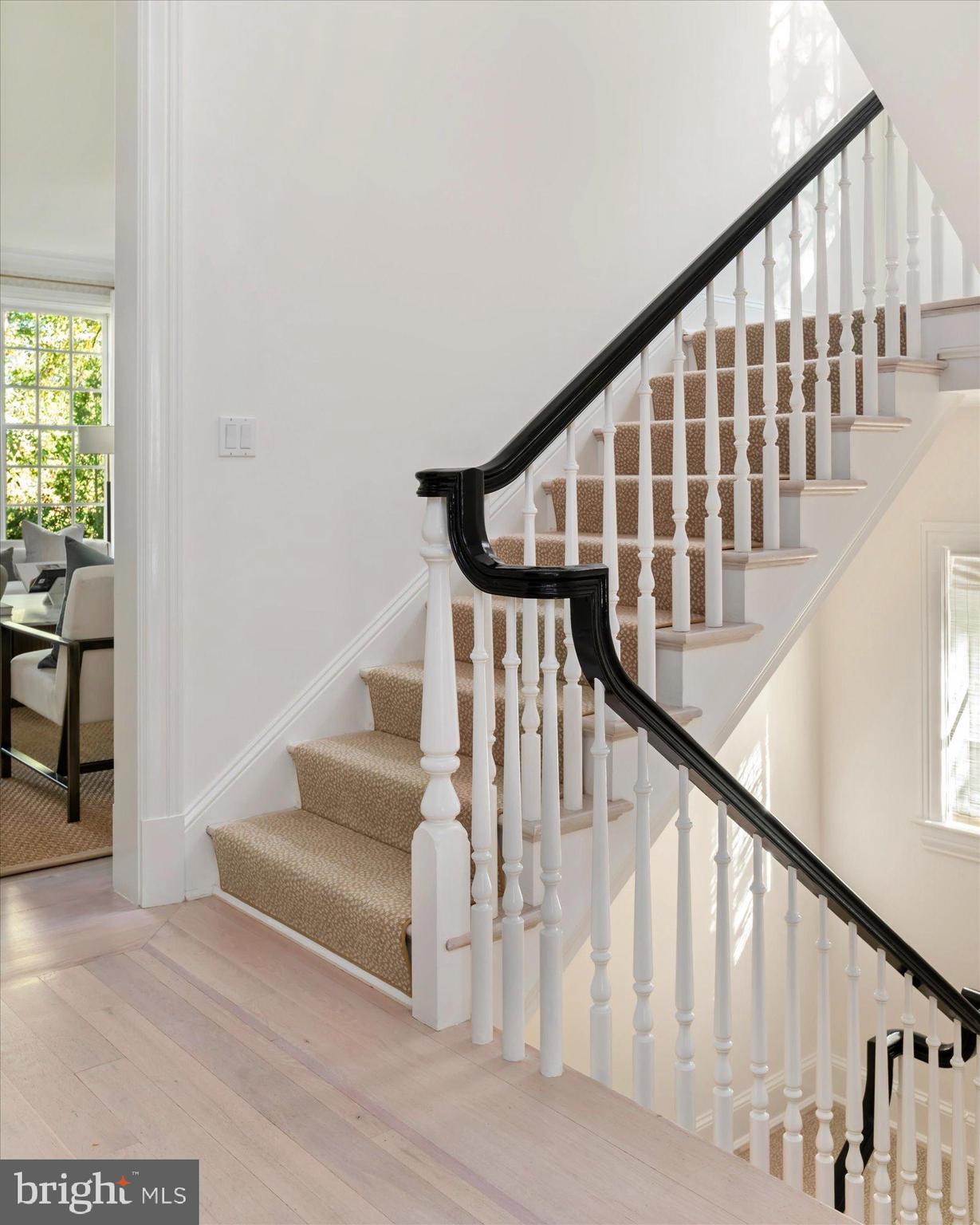 2950 Chain Bridge Road Northwest Washington, DC 20016 - Photo 17 of 50 a view of staircase with wooden floor and white walls