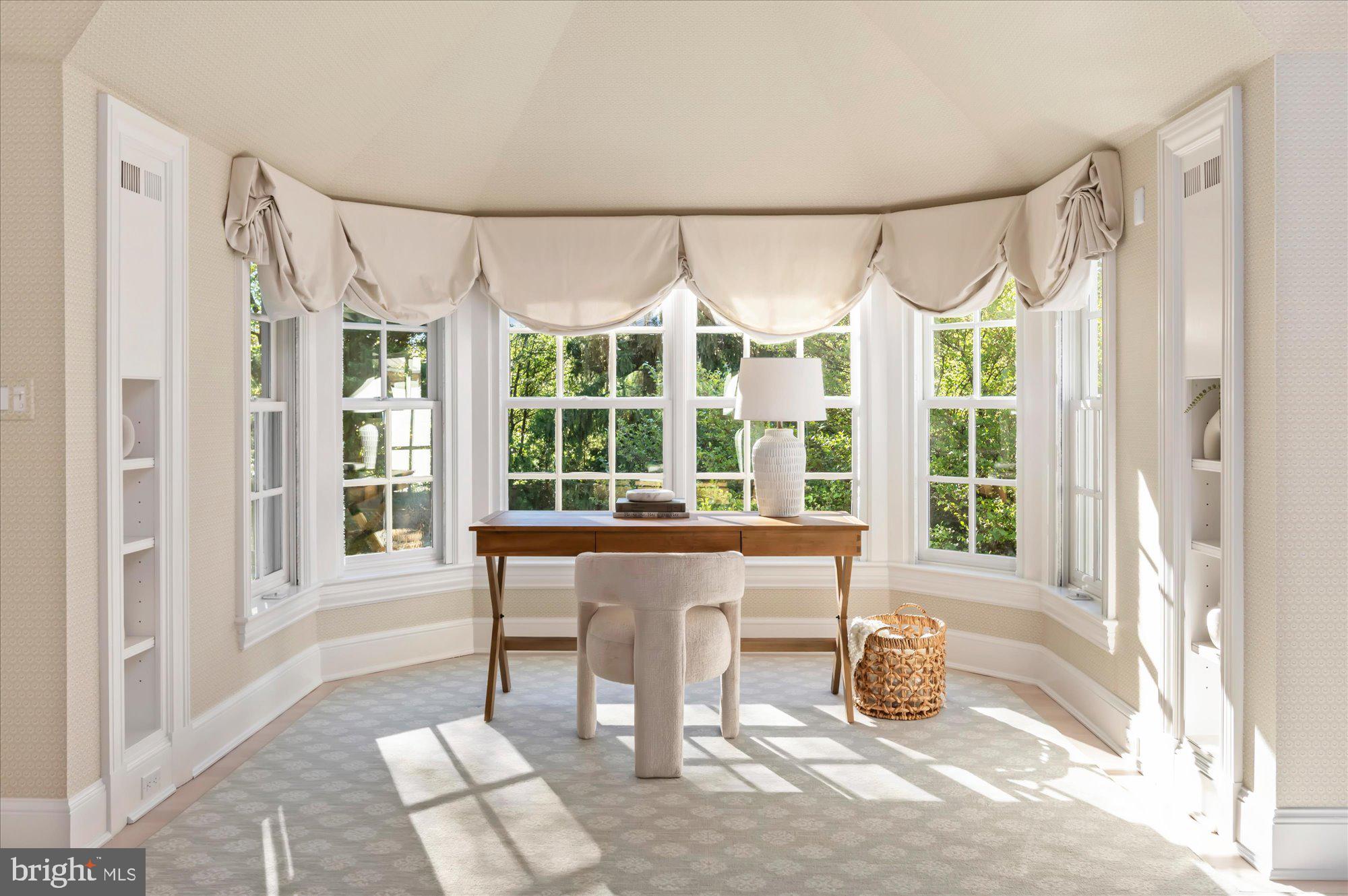 2950 Chain Bridge Road Northwest Washington, DC 20016 - Photo 20 of 50 a living room with a large window and a table
