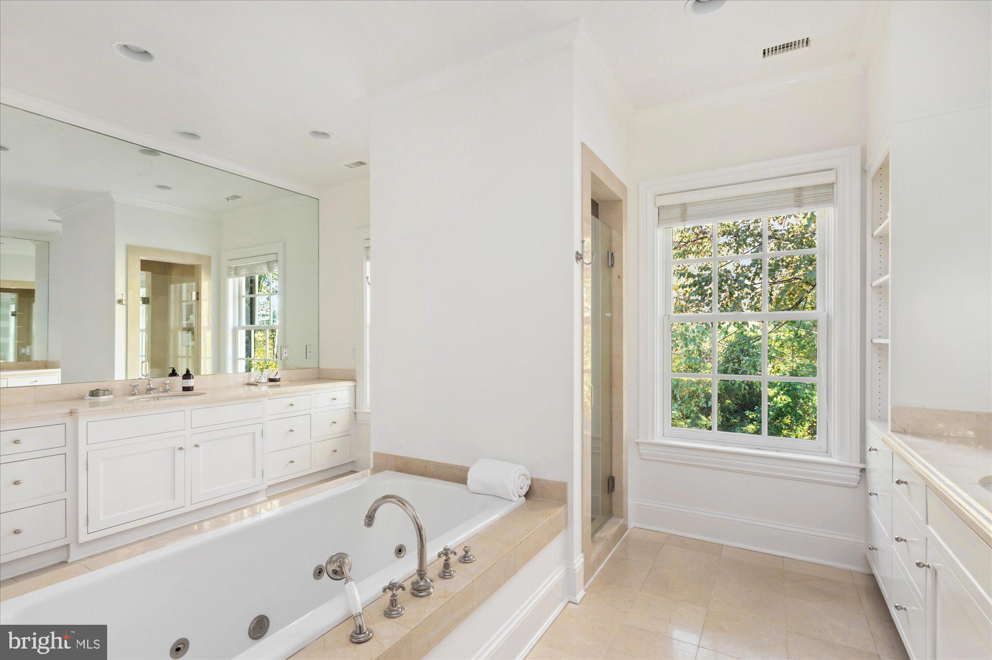 2950 Chain Bridge Road Northwest Washington, DC 20016 - Photo 22 of 50 a large white tub sitting in a bathroom next to a window