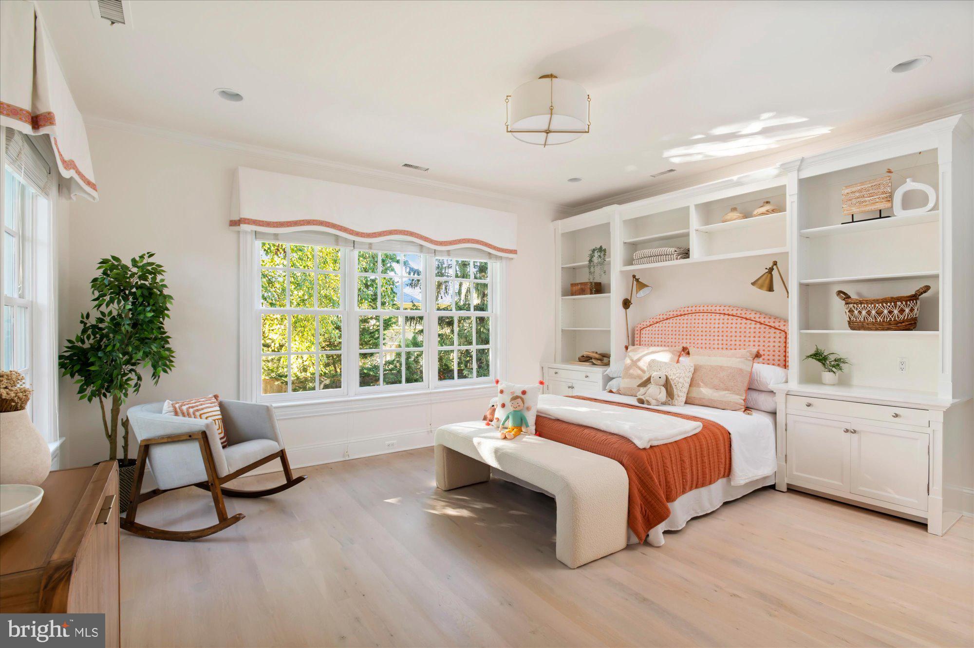 2950 Chain Bridge Road Northwest Washington, DC 20016 - Photo 25 of 50 a bedroom with a bed and a large window