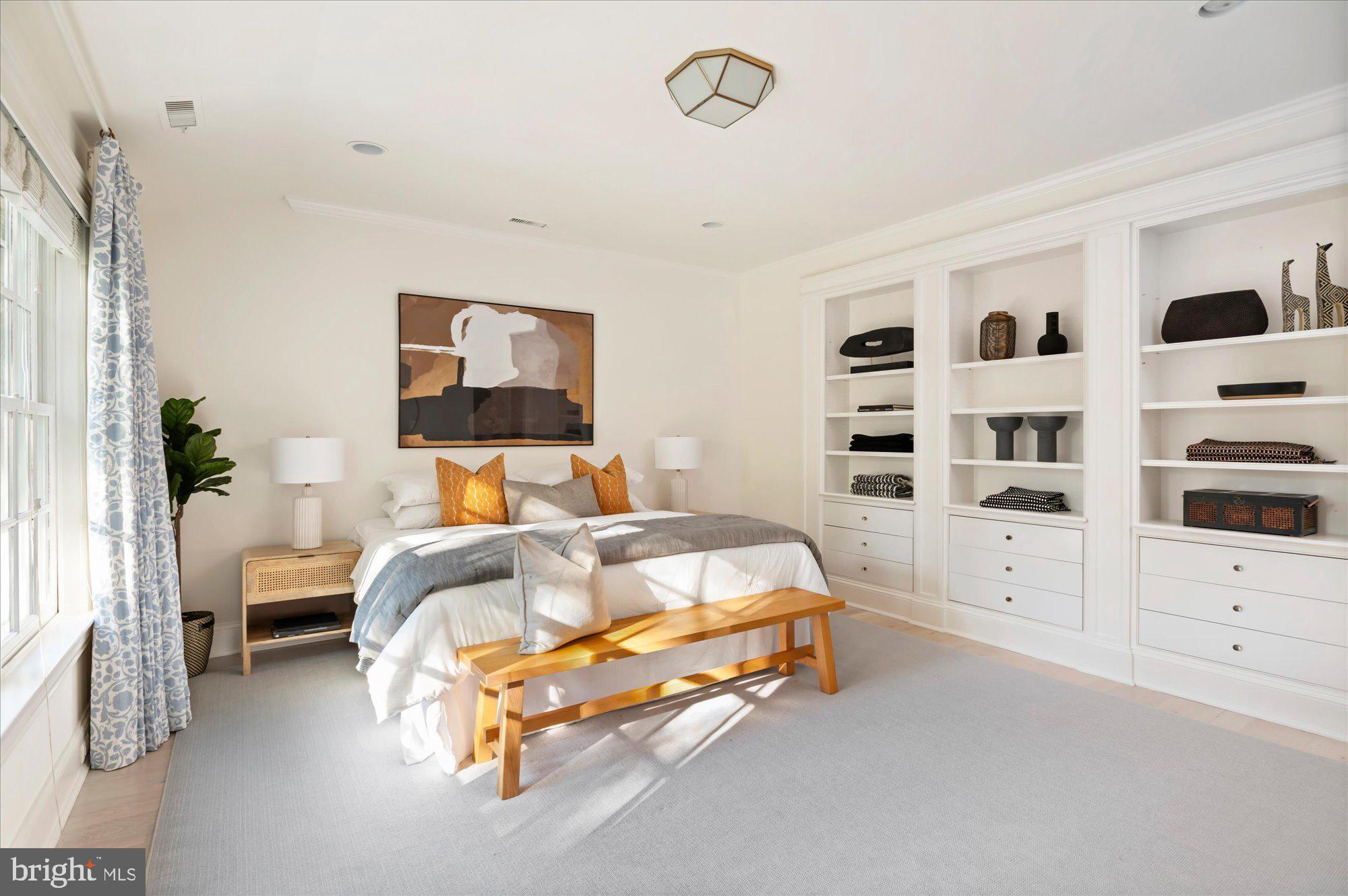 2950 Chain Bridge Road Northwest Washington, DC 20016 - Photo 26 of 50 a bedroom with a bed and a cabinets