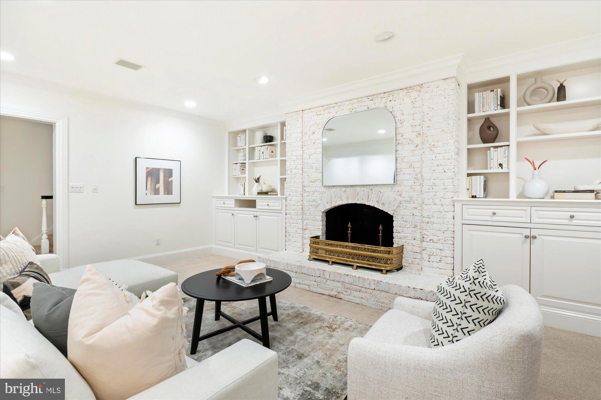 2950 Chain Bridge Road Northwest Washington, DC 20016 - Photo 34 of 50 a living room with furniture and a fireplace