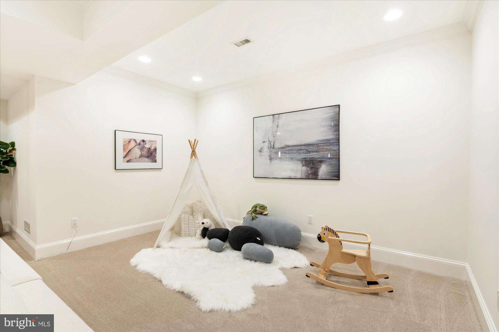 2950 Chain Bridge Road Northwest Washington, DC 20016 - Photo 36 of 50 a room with a baby bed and a couch