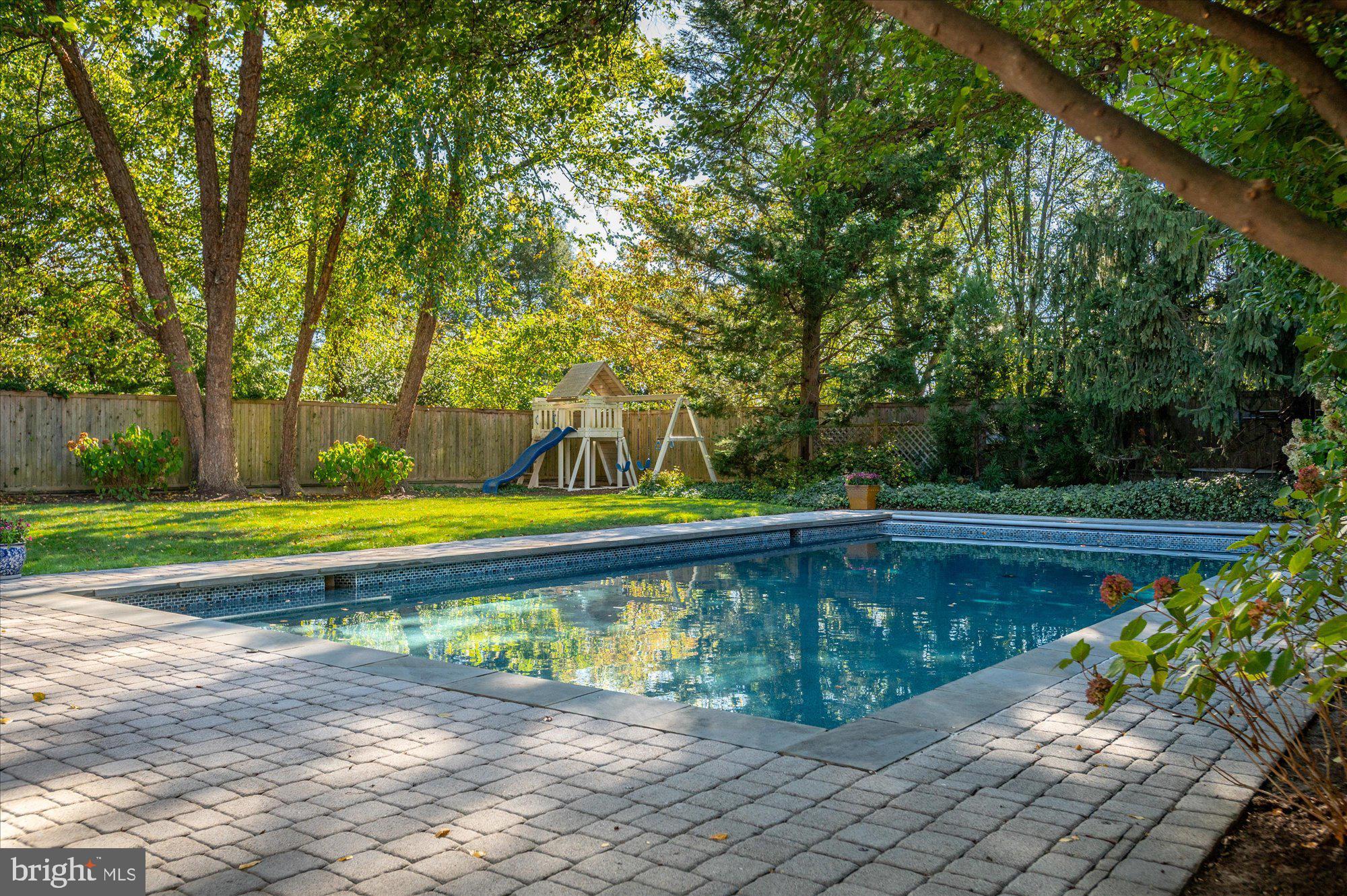 2950 Chain Bridge Road Northwest Washington, DC 20016 - Photo 46 of 50 a view of a swimming pool with a backyard