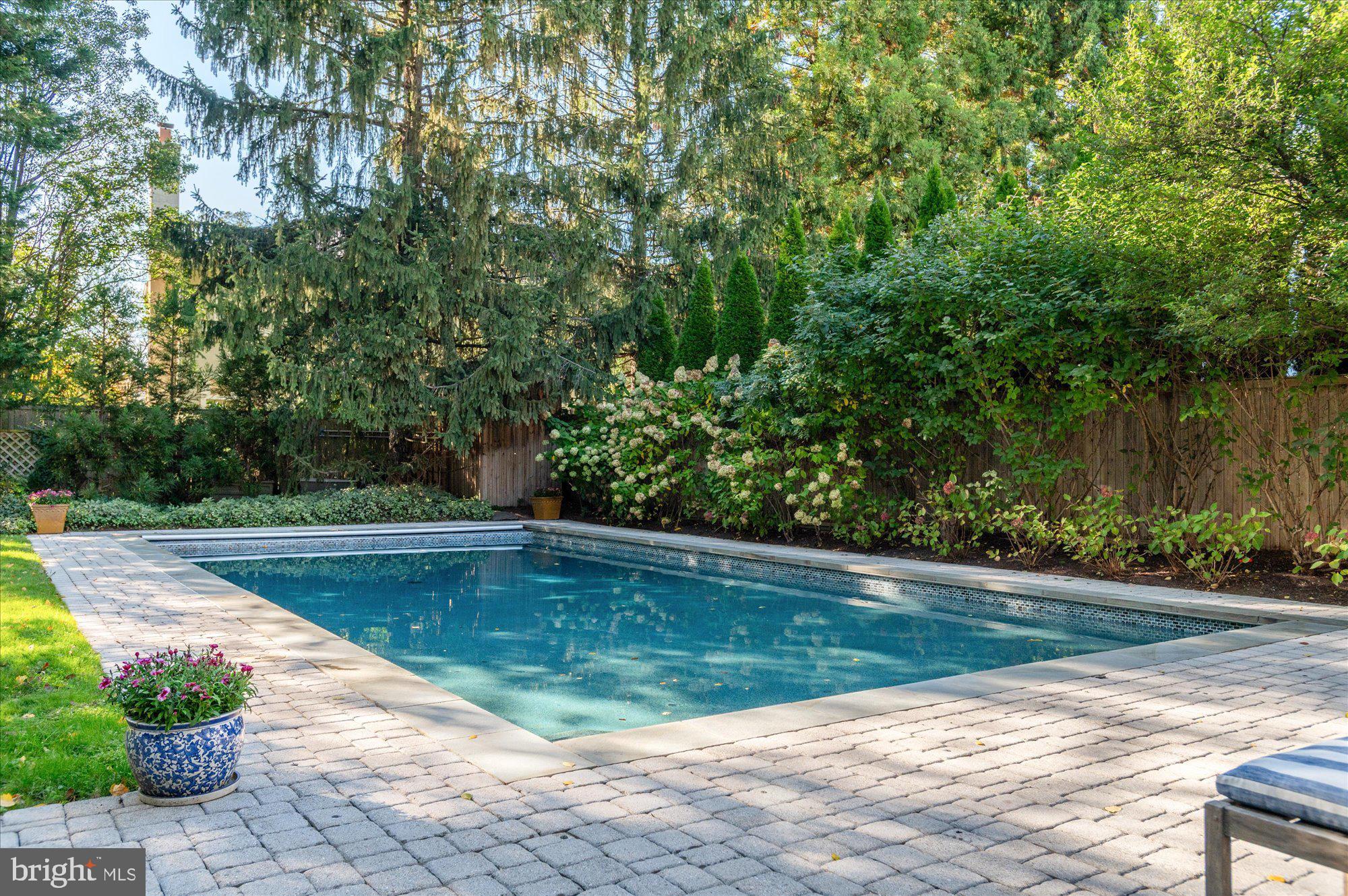 2950 Chain Bridge Road Northwest Washington, DC 20016 - Photo 47 of 50 a view of a swimming pool with a backyard