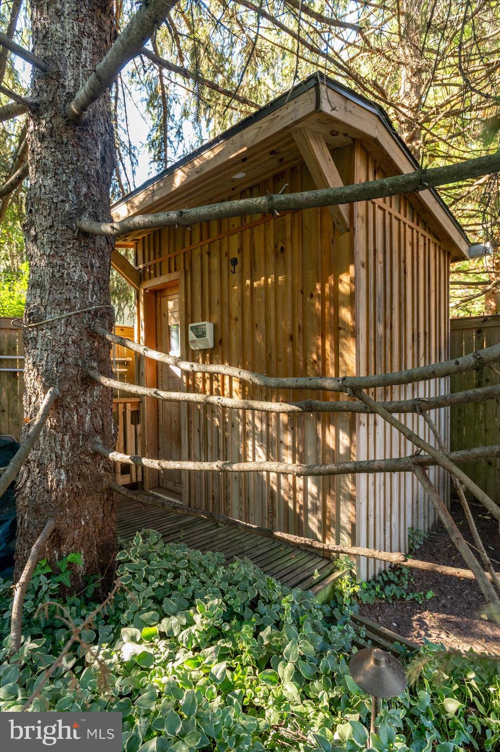 2950 Chain Bridge Road Northwest Washington, DC 20016 - Photo 49 of 50 a front view of a house with a yard