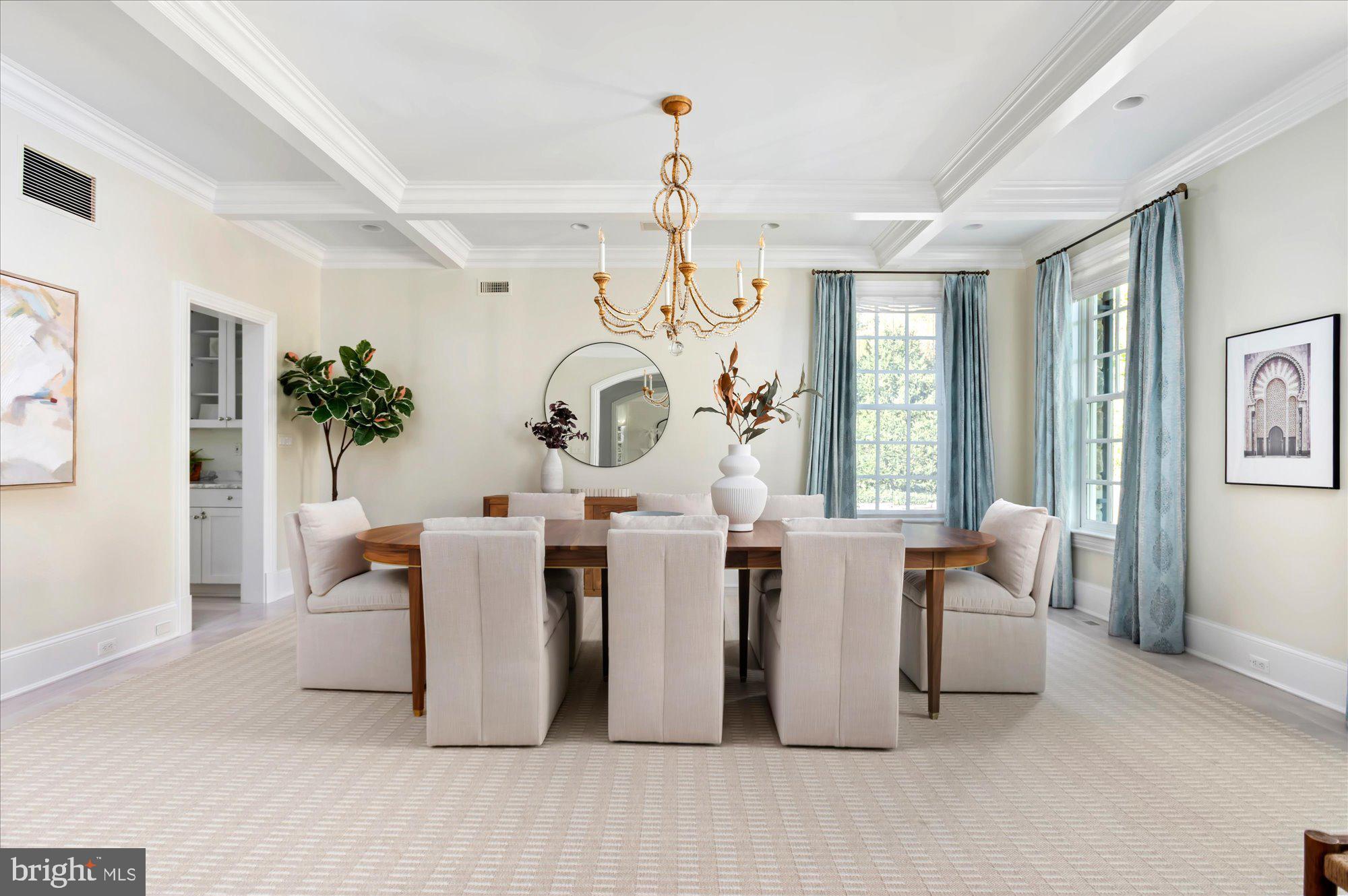 2950 Chain Bridge Road Northwest Washington, DC 20016 - Photo 9 of 50 a living room with couches a fireplace and a large mirror next to a window