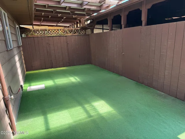 a view of backyard with tub