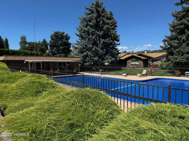 a view of balcony with wooden floor and outdoor seating