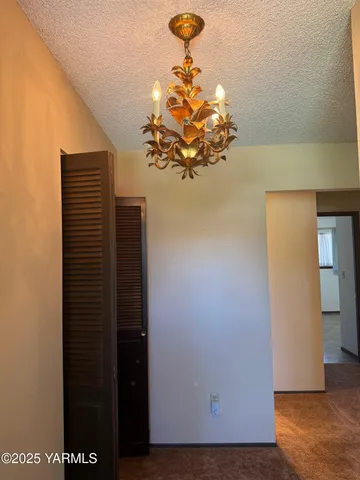 a view of a hallway with a flower pot