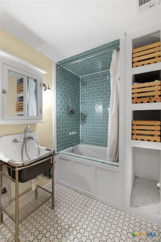 a bathroom with a sink and a bathtub