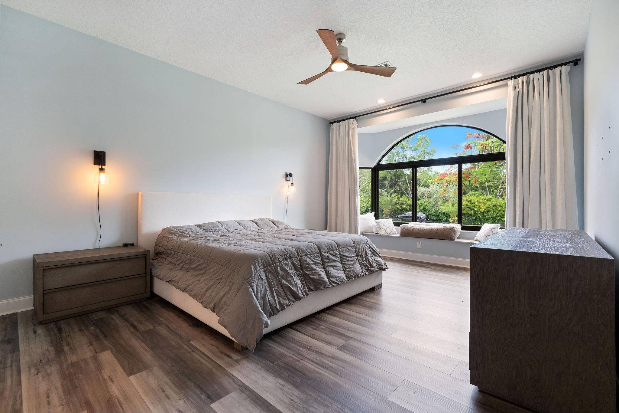 5350 Southwest 198th Terrace Southwest Ranches, FL 33332 - Photo 29 of 51 a bedroom with a large bed and a large window