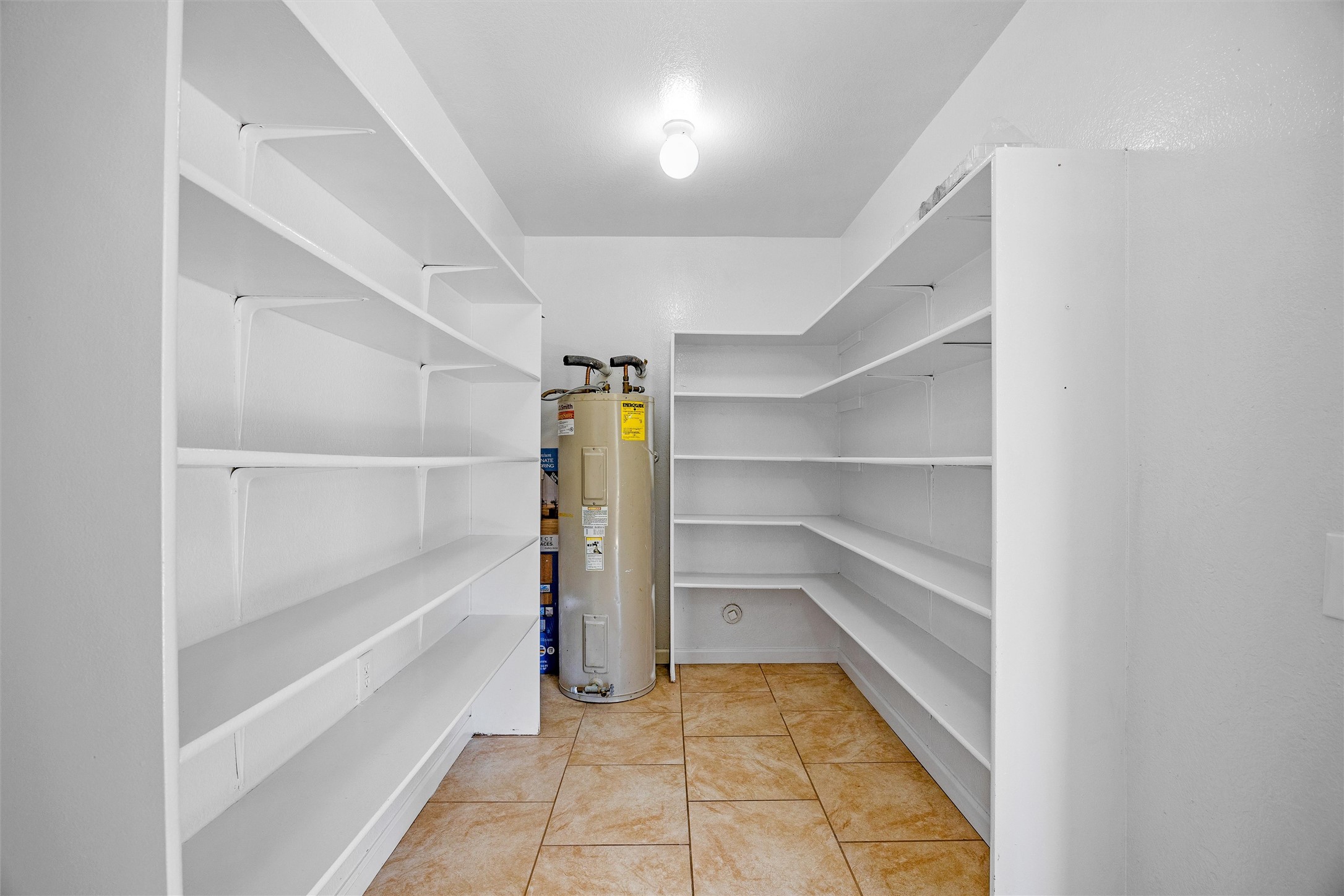 7541 Redrick Drive Austin, TX 78747 - Photo 23 of 40 Pantry with water heater
