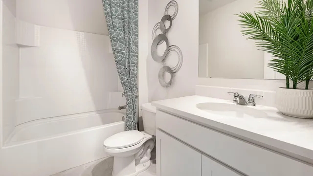 a bathroom with a sink a toilet and a bathtub